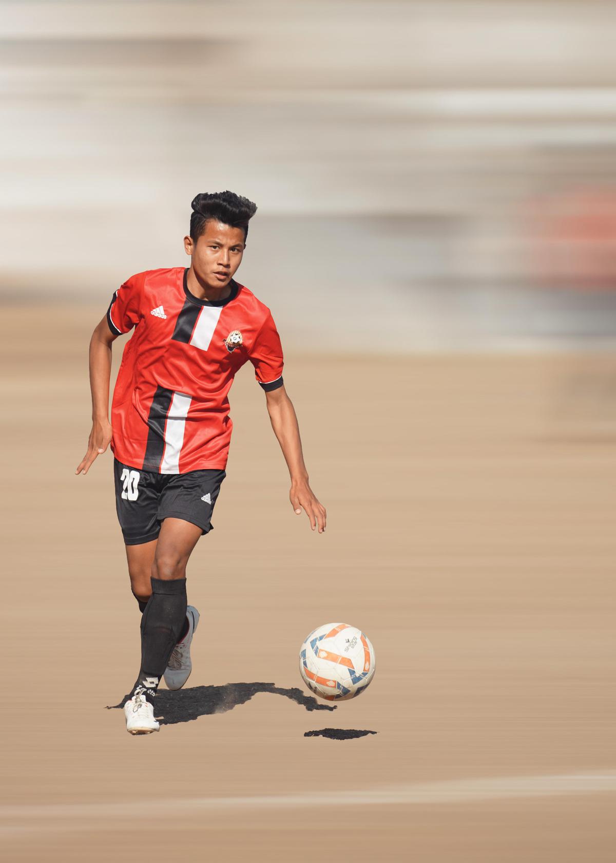 Image of Player, Ball, Football, Jersey, Sports equipment, Sports uniform etc.