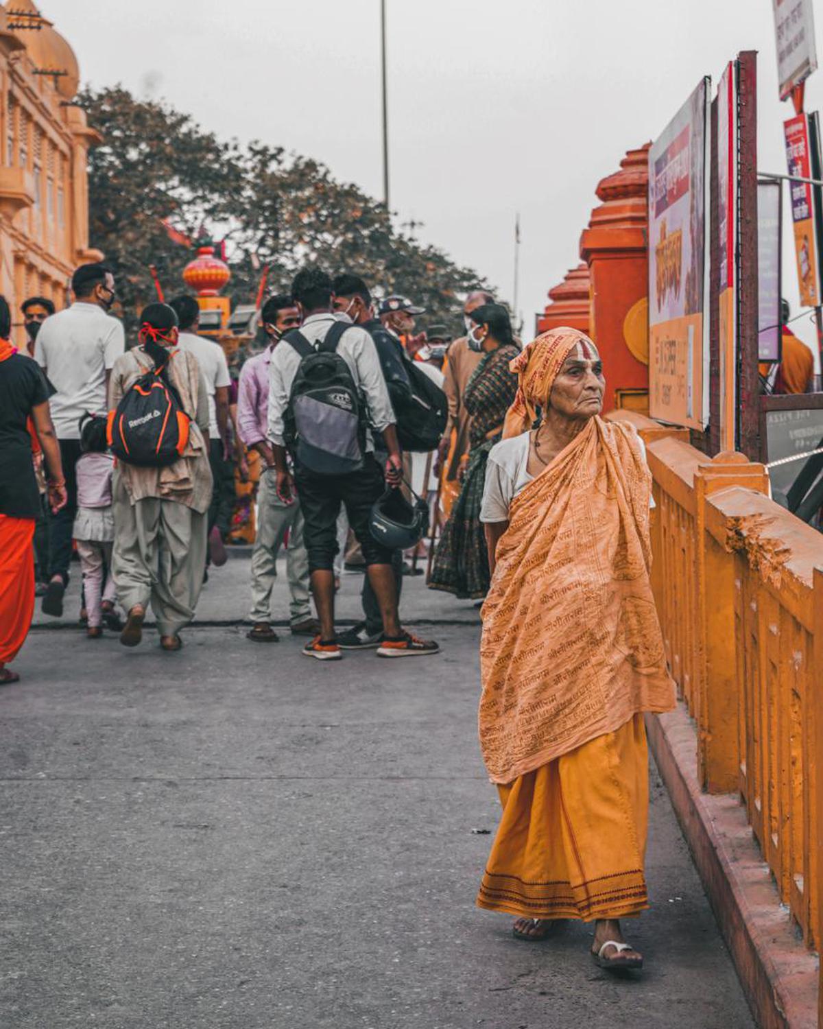 Image of Temple, Sky, Orange, Headgear, Human, Travel etc.