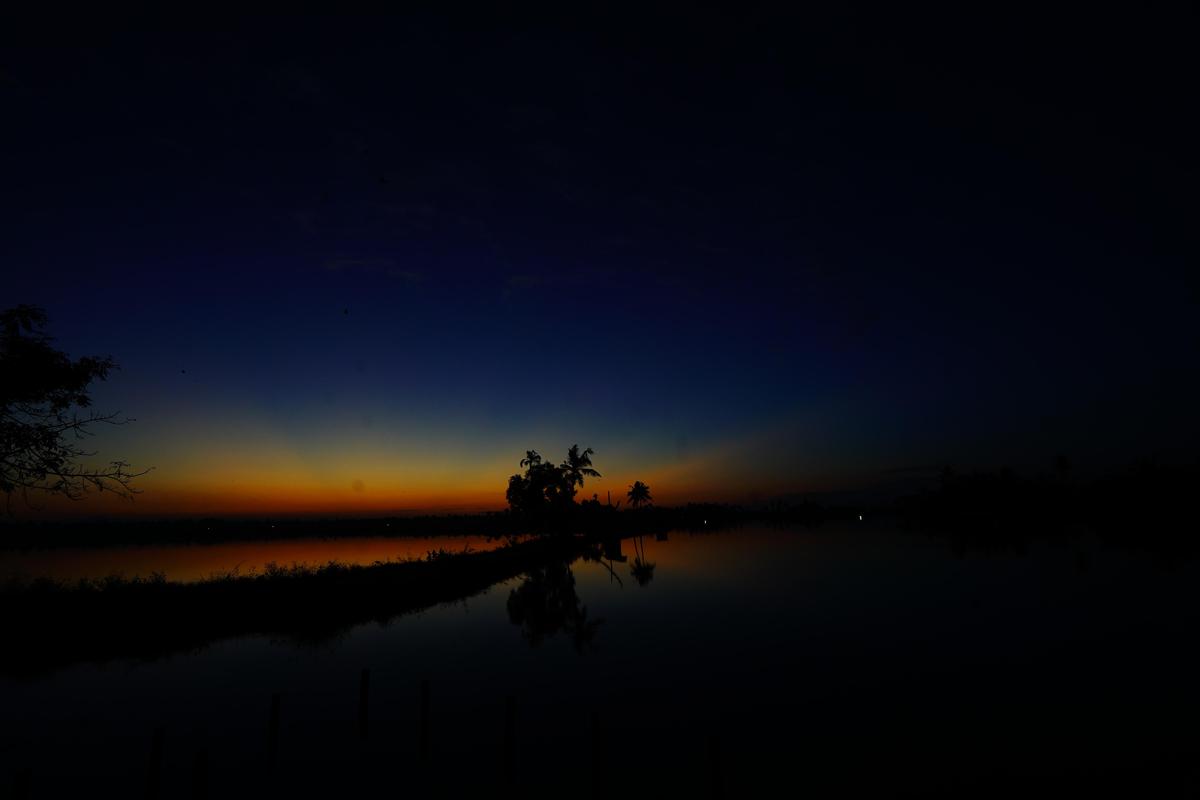 Image of Sky, Afterglow, Tree, Cloud, Natural landscape, Water etc.