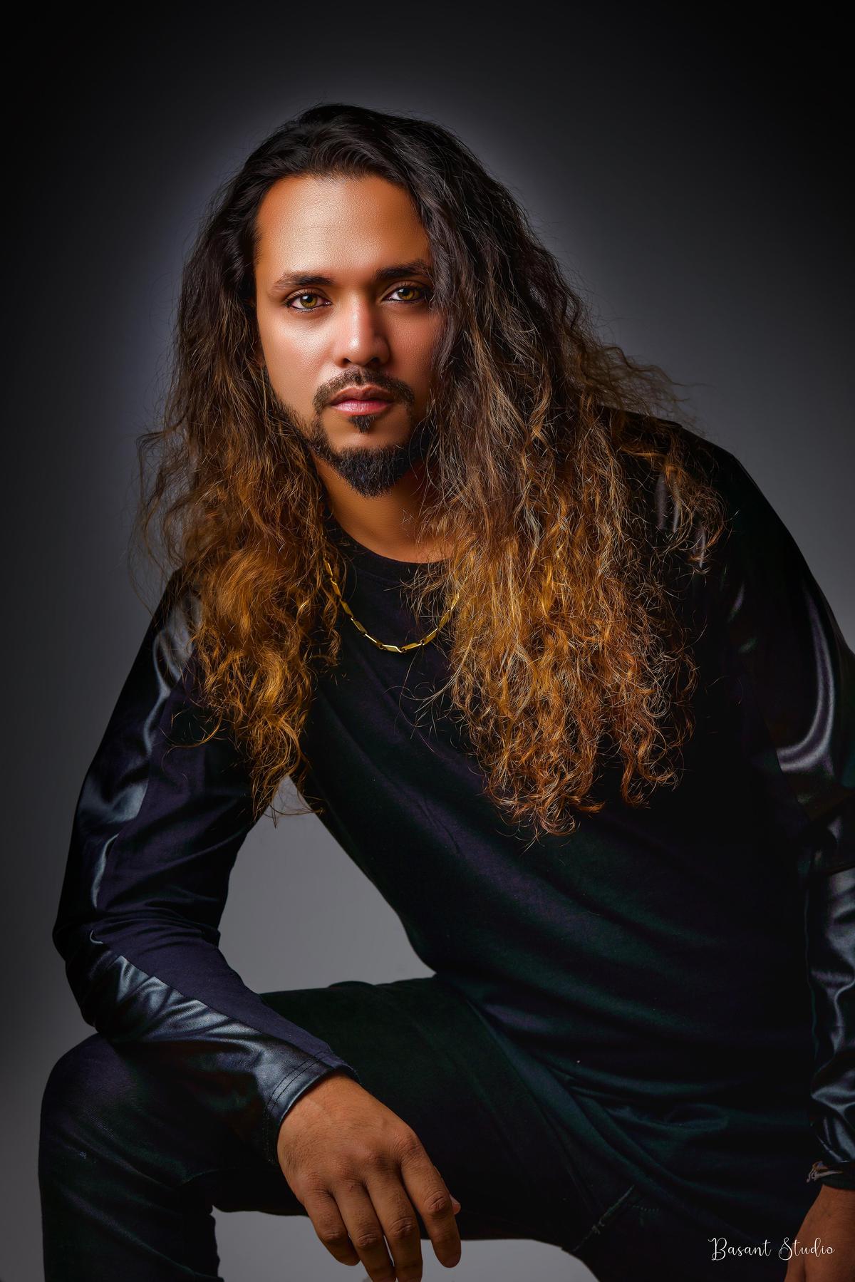 Image of Black, Outerwear, Beard, Chin, Eyebrow, Lip etc.